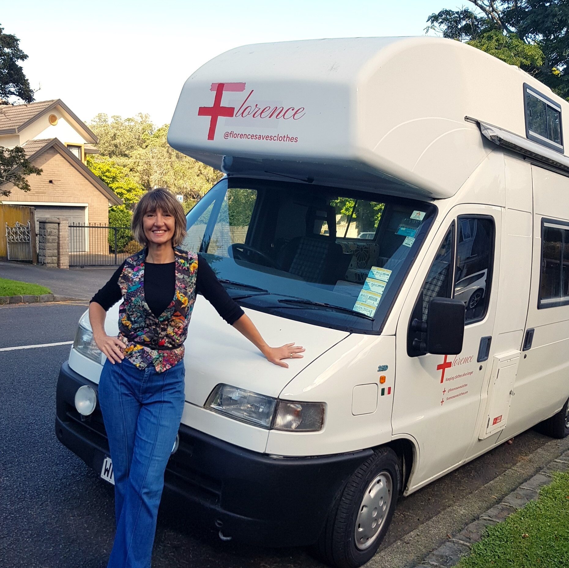 Sallly leans on the Florence mobile mending van she will be taking around Auckland to repair clothes for people.